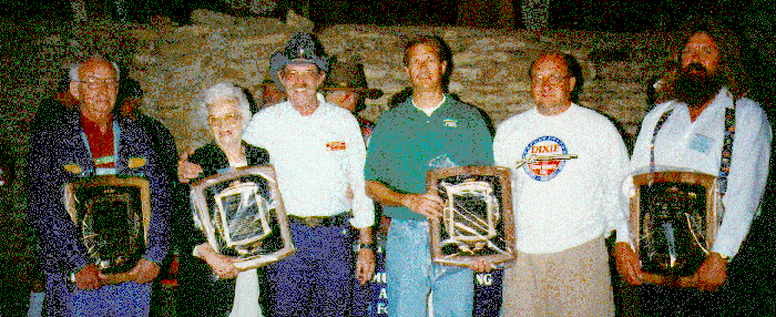 1996 Black Powder Hall of Fame inductees Merrill P. Deer, Maxine Moss with NMLRA President Marty Murphy. Hunter Kirkland, Charles Kirkland, and Charles Haffner, Jr. accepted the awards for their fathers, Turner Kirkland and Charles Haffner, Sr. who were unable to attend.