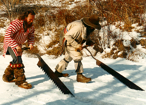 Carl Beck and Clyde Fisher sawing ice.