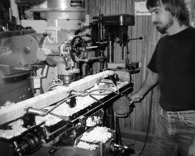 Fig. 2. After shaping the buttstock, Doug Greensides places the stock in a fixture of his own design for milling of the barrel channel.
