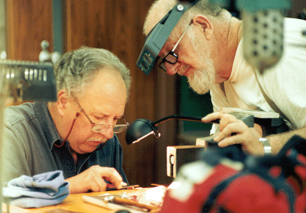 Mark Silver (left) and student Ed Willis sharpening a graver.